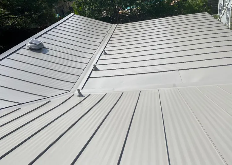 Solar attic fan installed on a metal roof for Roof Ventilation in Obetz